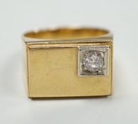 A 750 yellow metal and single stone diamond set signet ring, size Q/R, gross weight 10 grams.