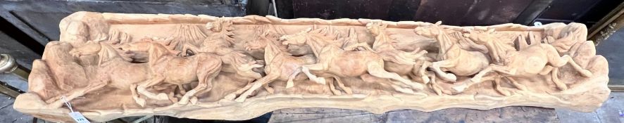 An unusual, probably American, carved wood panorama of eight galloping horses, width 200cm, height