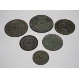 A group of six Chinese archaic bronze mirrors, including two Han dynasty TLV mirrors, and a Tang