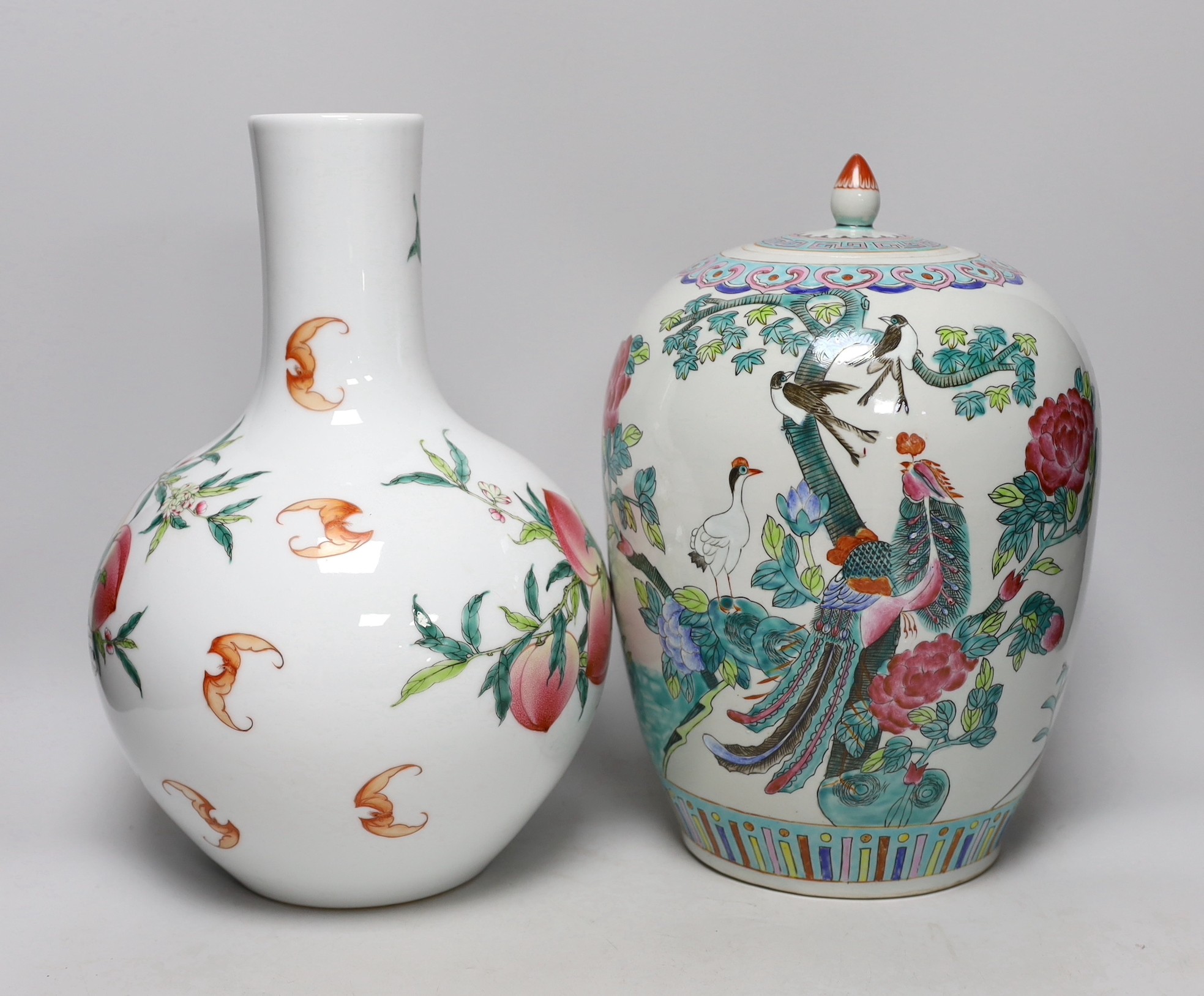 A Chinese vase with cover, with a peach and bat bottle vase, tallest 35cm high - Image 2 of 2