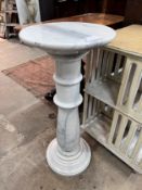 A circular marble pedestal, diameter 35cm, height 80cm *Please note the sale commences at 9am.