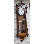 A late 19th century walnut and ebonised Vienna wall clock, height 118cm *Please note the sale