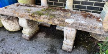 A reconstituted stone garden bench, length 128cm, depth 37cm, height 45cm *Please note the sale