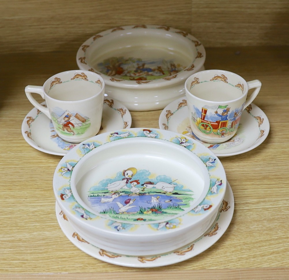 A selection of seven Royal Doulton Bunnykins tablewares, together with a Quack Quack Wade bowl