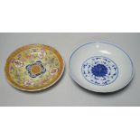 A Chinese blue and white dish and a similar enamelled dish, largest 20cm