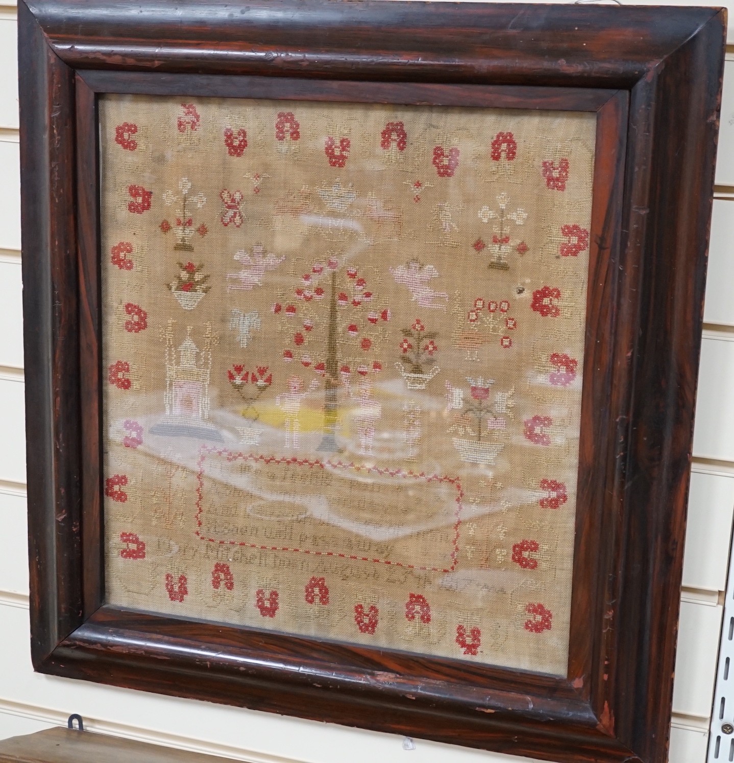 A large framed sampler, 1817, 57 x 56cm including frame