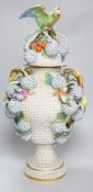 A large 19th century Jacob Petit floral encrusted two handled vase and cover, decorated with birds