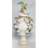 A large 19th century Jacob Petit floral encrusted two handled vase and cover, decorated with birds