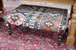 A Victorian style stool with Kelim upholstery, width 96cm, depth 64cm *Please note the sale