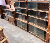 Five 1960's oak Minty bookcases comprising two four section, one three section, and a near pair of
