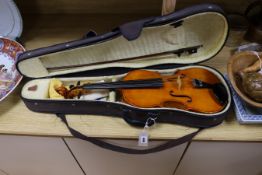 A cased viola crackled glaze, with bow