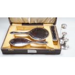 A George V cased three piece silver and tortoiseshell pique mounted mirror and brush set (lacking
