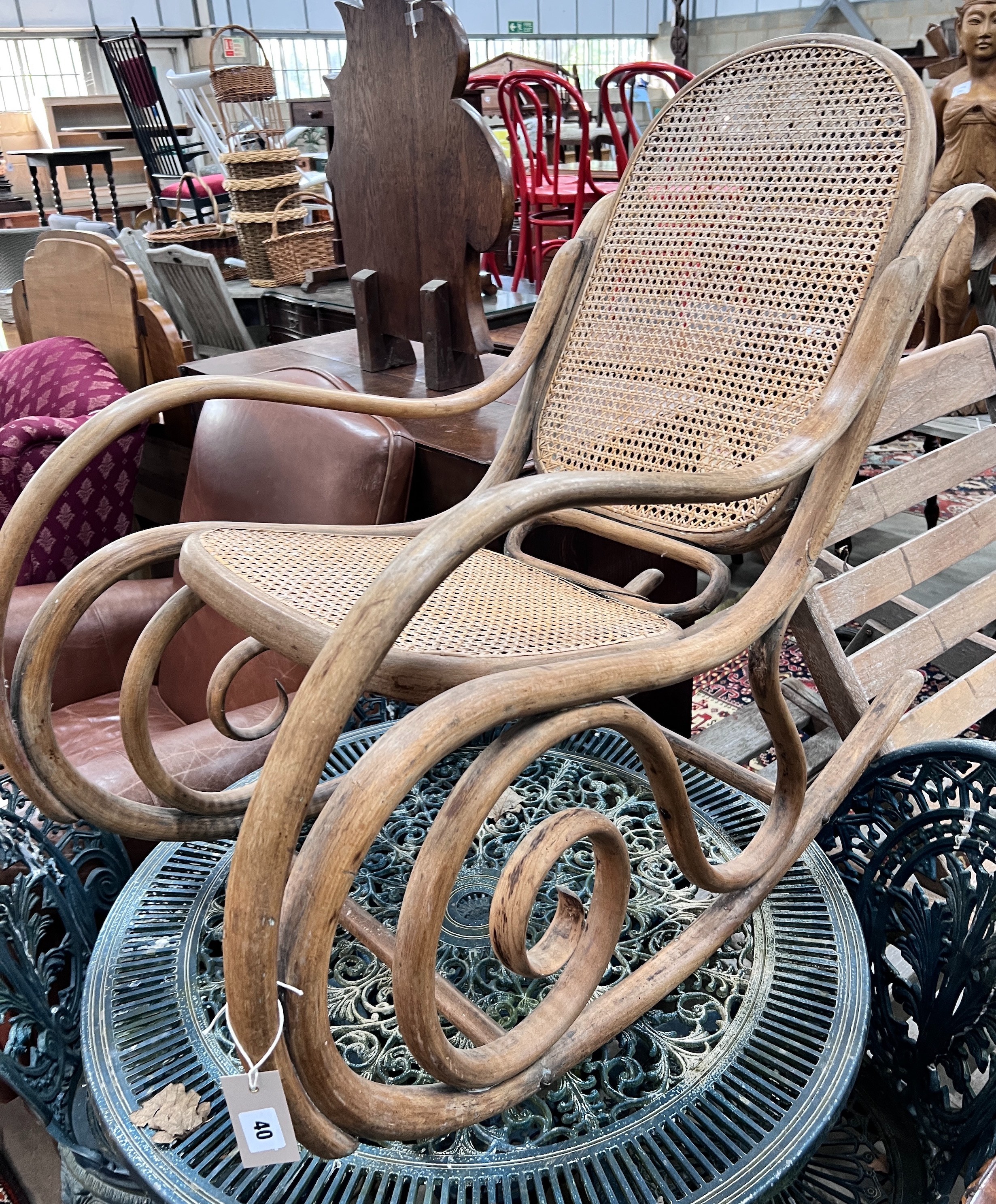 A caned bentwood rocking chair, width 52cm, height 88cm *Please note the sale commences at 9am.