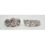 A modern 18ct white gold and diamond set triple cluster ring, size M and a similar 18ct white gold