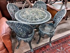 A Victorian style circular aluminium table, diameter 80cm, height 69cm and four matching chairs *