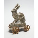 A late Victorian / Edwardian confectioners’ rabbit shaped mould, on four wheels, 15cm tall