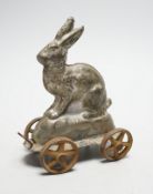 A late Victorian / Edwardian confectioners’ rabbit shaped mould, on four wheels, 15cm tall