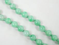 A single strand jade bead necklace, 58cm, gross weight 91 grams.