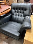 A G Plan black leatherette upholstered revolving armchair, width 93cm, depth 82cm, height 82cm *