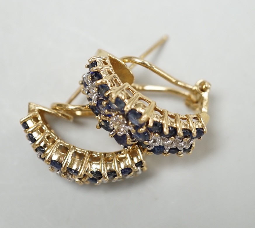 A modern pair of 14k yellow metal, sapphire and diamond cluster set demi-lune earrings, 19mm, - Image 2 of 2