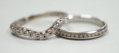 A modern 18ct white gold and diamond chip set full eternity ring, size O and a modern 18ct white