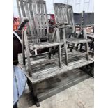 A weathered teak extending garden table with five matching folding armchairs, length 195cm, depth