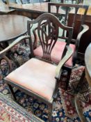 A George III provincial mahogany elbow chair together with a later elbow chair *Please note the sale