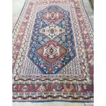 A Caucasian blue ground rug, 256 x 158cm *Please note the sale commences at 9am.