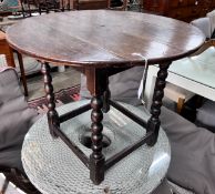 A circular oak bobbin legged table, diameter 73cm, height 61cm *Please note the sale commences at