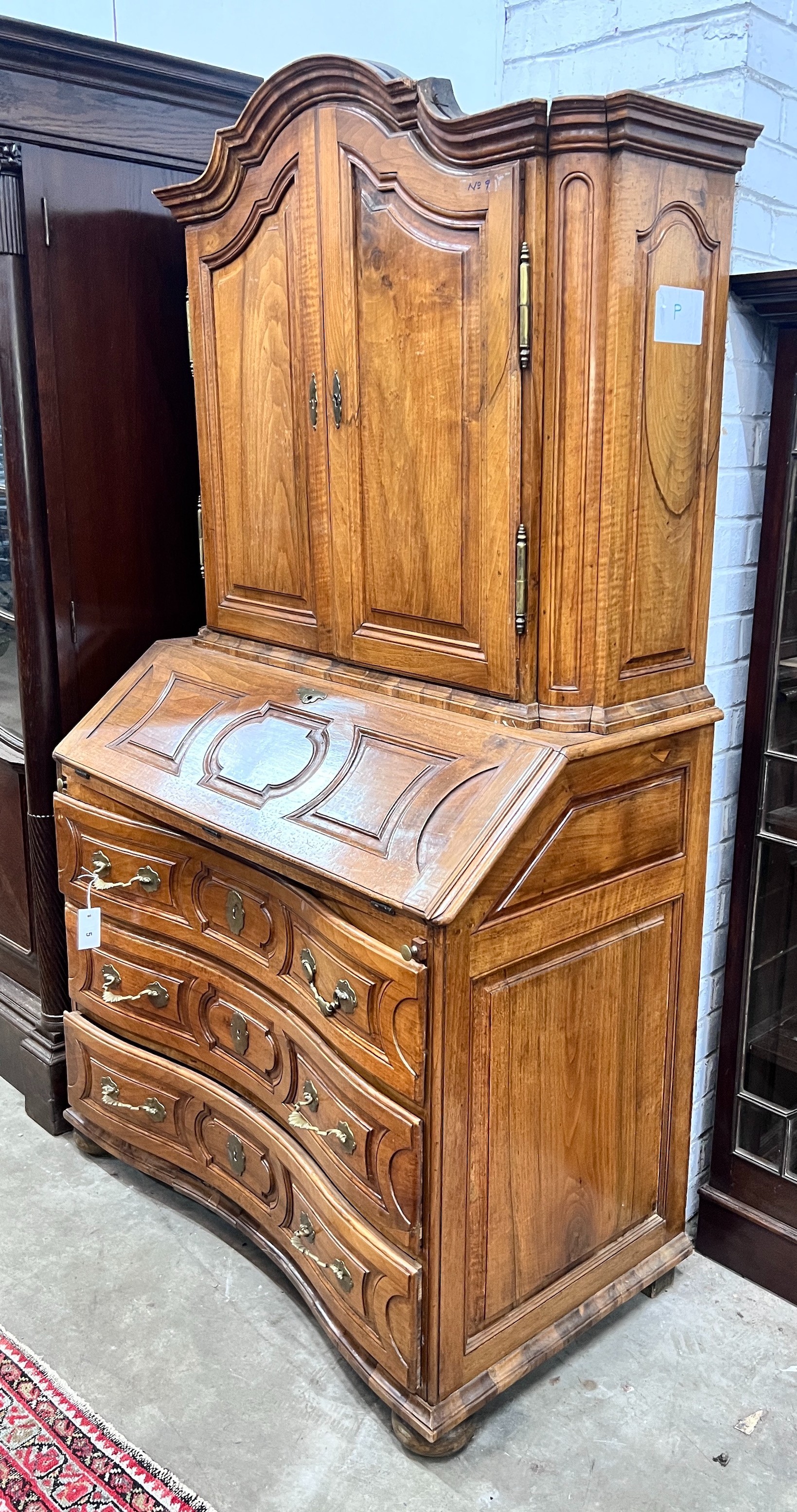 A 19th century German walnut bureau cabinet, width 105cm, depth 57cm, height 188cm*Please note the