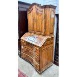 A 19th century German walnut bureau cabinet, width 105cm, depth 57cm, height 188cm*Please note the