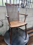 An Arts & Crafts beech Windsor comb back elbow chair, width 49cm, depth 41cm, height 86cm *Please