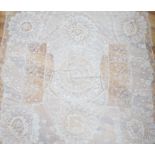 A late 19th century Normandy lace table cover of hand spun linen, hand white worked, with Brussels