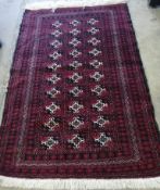 A Bokhara burgundy ground rug, 164 x 110cm *Please note the sale commences at 9am.