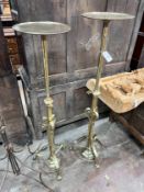 A pair of ecclesiastical brass telescopic candle stands, maximum height 135cm *Please note the