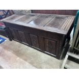 An early 18th century panelled oak coffer, width 154cm *Please note the sale commences at 9am.