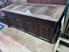 An early 18th century panelled oak coffer, width 154cm *Please note the sale commences at 9am.