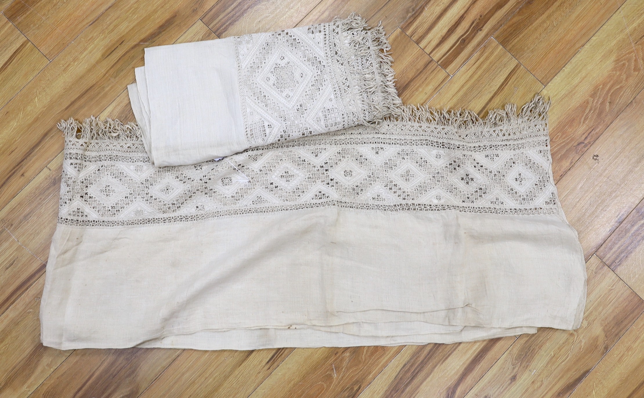 A pair of 19th century Greek hand worked and embroidered linen pelmets, 440cms long (each)