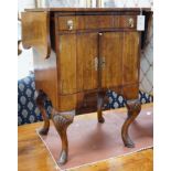 A 1930's walnut bedside cabinet, width 55cm *Please note the sale commences at 9am.