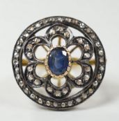An Indian pierced yellow metal, sapphire and rose cut diamond set circular cluster ring, size N/O,