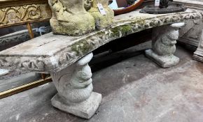 A reconstituted stone curved garden bench, width 160cm, height 46cm *Please note the sale