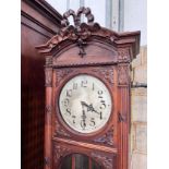 An early 20th century French carved walnut thirty hour longcase clock, height 224cm *Please note the
