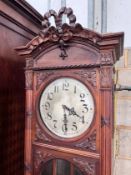 An early 20th century French carved walnut thirty hour longcase clock, height 224cm *Please note the