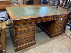 A reproduction George III style mahogany pedestal partner's desk, width 152cm, depth 91cm, height
