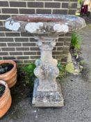 A circular reconstituted stone bird bath, diameter 65cm, height 94cm *Please note the sale commences