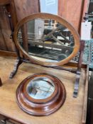 An Edwardian skeleton toilet mirror, 44cm, and a convex wall mirror, 26cm *Please note the sale