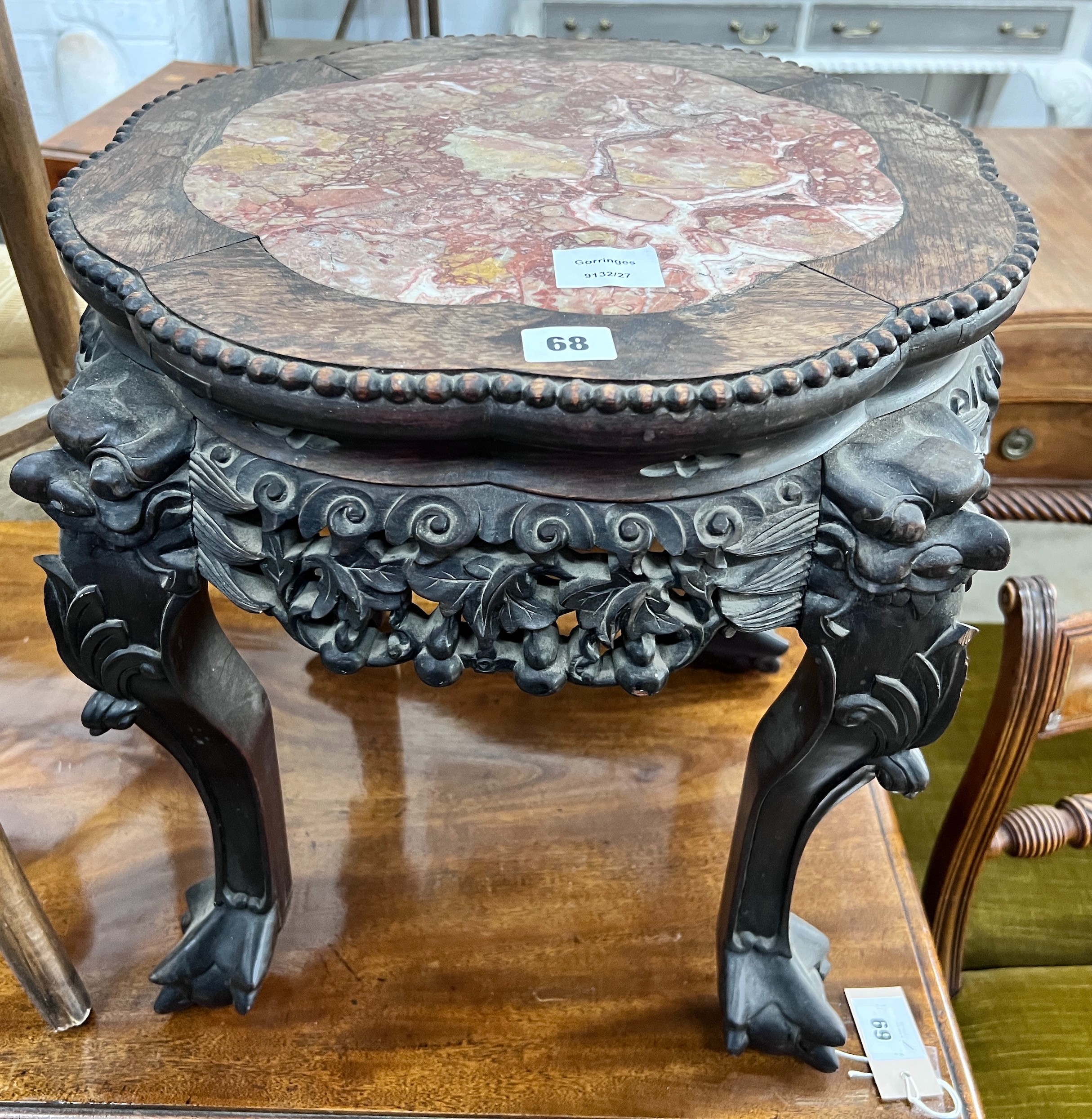 A Chinese carved hardwood rouge marble-topped jardiniere stand, diameter 43cm, height 46cm *Please