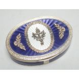 A 1920's continental 835 standard white metal, enamel and marcasite set oval box, 69mm.