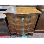 A George III style walnut serpentine fronted chest, fitted four long graduated drawers, width