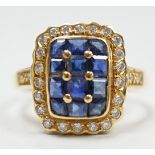 A modern 18ct gold, sapphire and diamond set cluster ring, size M, gross weight 4.7 grams.